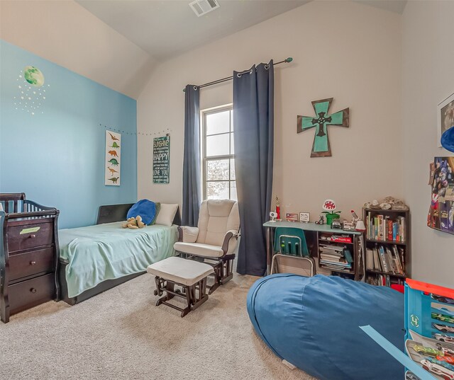 bedroom featuring light colored carpet and lofted ceiling