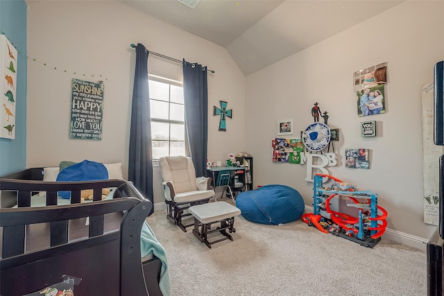 bedroom with carpet floors and vaulted ceiling