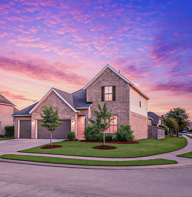 5623 Mae St, Katy, TX 77493 - traditional-style house featuring brick siding, concrete driveway, a yard, and a garage