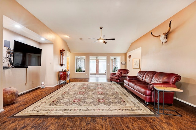 living room featuring dark wood-type flooring, ceiling fan, and lofted ceiling