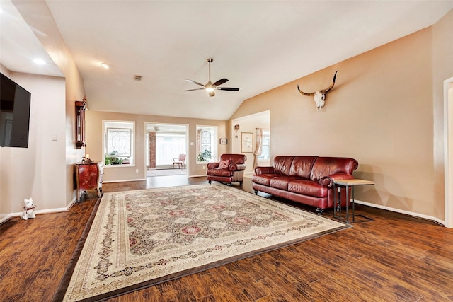 living room with lofted ceiling, dark wood-type flooring, and ceiling fan