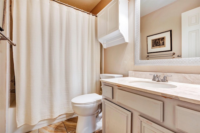 full bathroom featuring vanity, shower / tub combo, and toilet