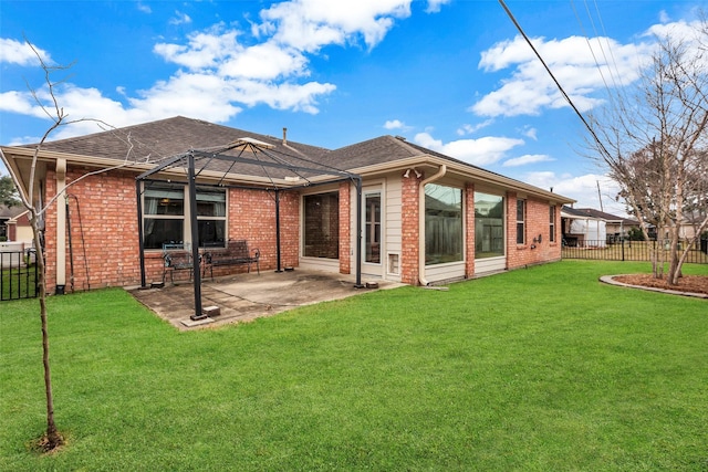 back of house with a yard and a patio area