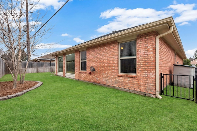 rear view of property featuring a yard