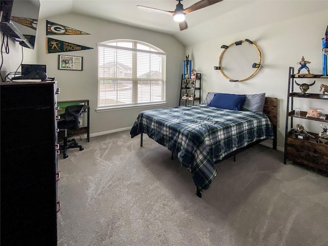 carpeted bedroom with baseboards, lofted ceiling, and a ceiling fan