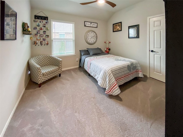 carpeted bedroom featuring lofted ceiling, a ceiling fan, and baseboards