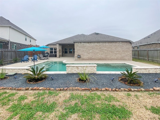 view of pool featuring a fenced backyard, a fenced in pool, and a patio