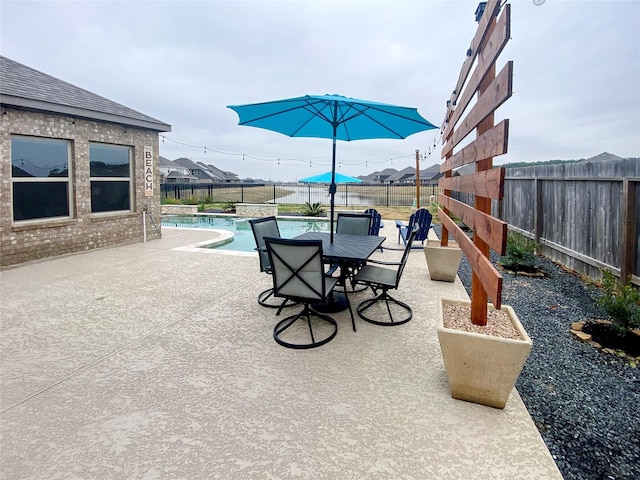 view of patio with a fenced in pool and a fenced backyard