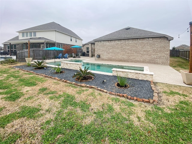 view of pool with a patio area, a yard, a fenced backyard, and a fenced in pool