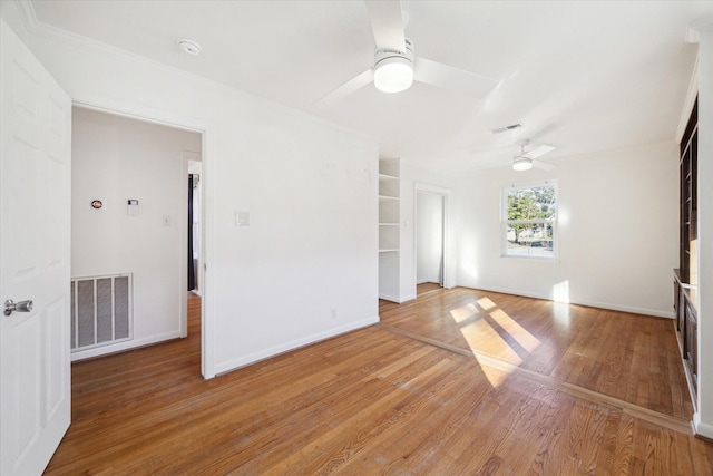 unfurnished living room with hardwood / wood-style flooring and ceiling fan