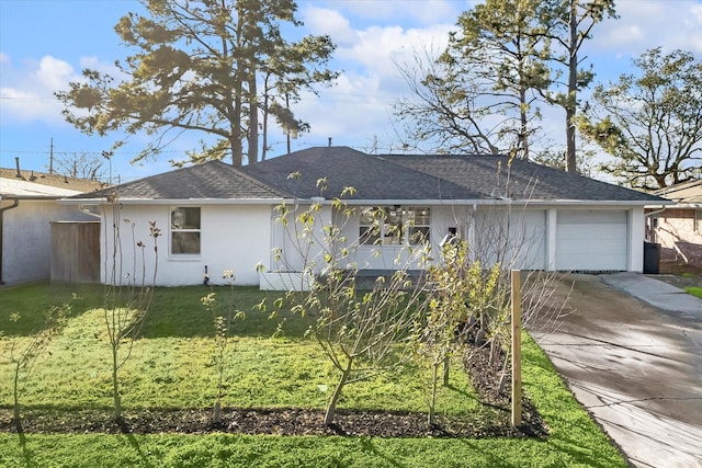 ranch-style house featuring a garage and a front lawn