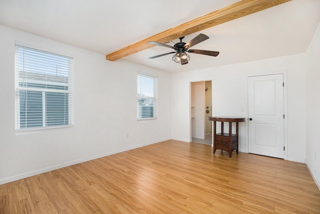 unfurnished room featuring beamed ceiling, ceiling fan, and light hardwood / wood-style floors