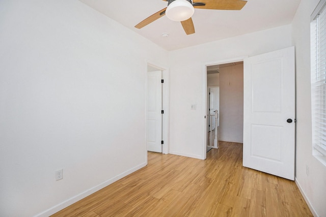 unfurnished bedroom featuring ceiling fan and light hardwood / wood-style floors