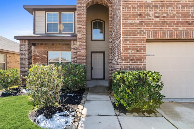 view of exterior entry featuring a garage