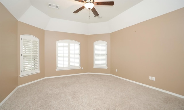 carpeted spare room featuring ceiling fan