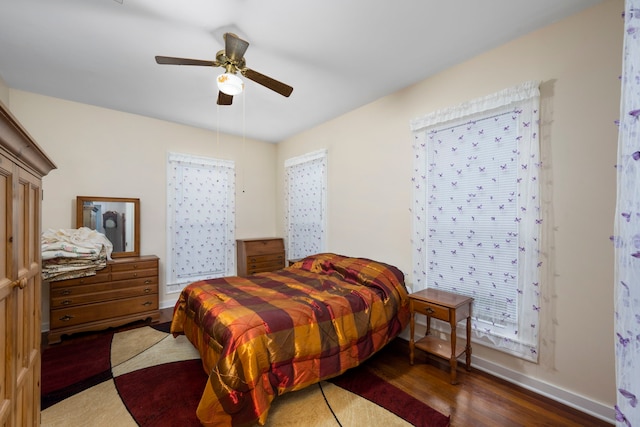 bedroom featuring ceiling fan and dark hardwood / wood-style flooring