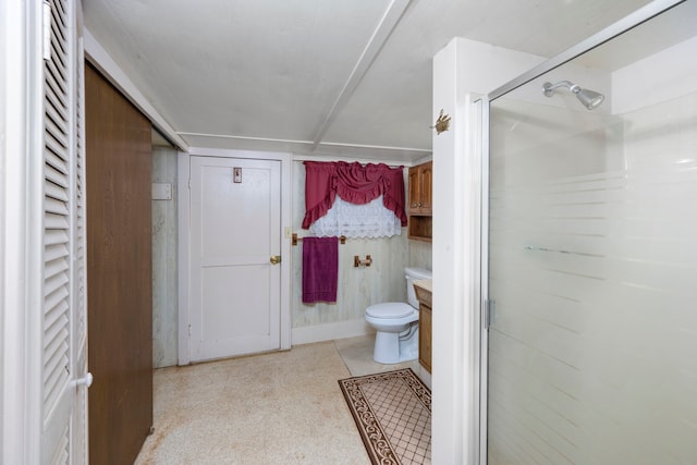 bathroom with walk in shower, vanity, and toilet