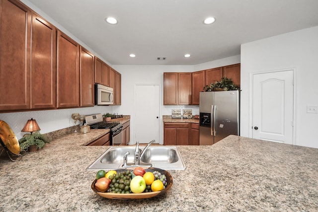 kitchen with sink and appliances with stainless steel finishes