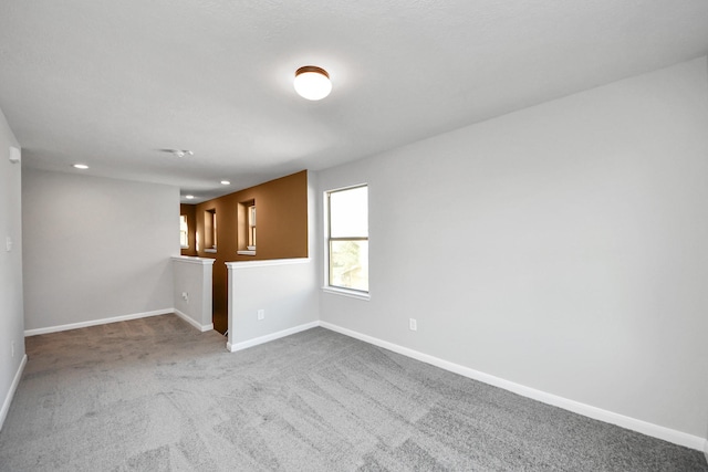 spare room featuring carpet floors