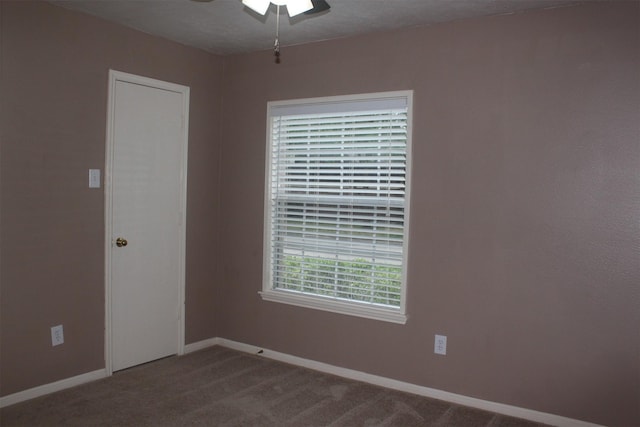 unfurnished room with carpet floors and a textured ceiling