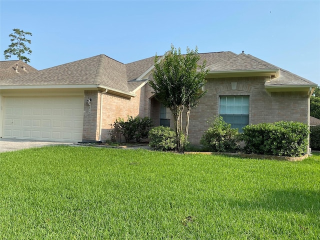 ranch-style house featuring a garage and a front lawn