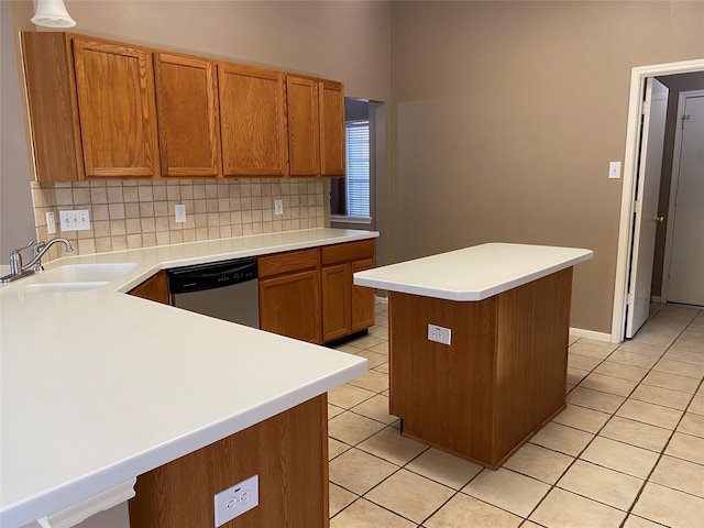 kitchen with dishwasher, sink, decorative backsplash, light tile patterned floors, and kitchen peninsula