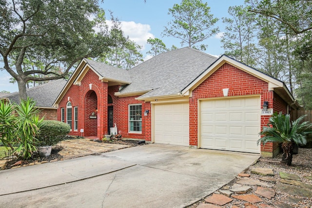 view of front facade with driveway, an attached garage, brick siding, and roof with shingles