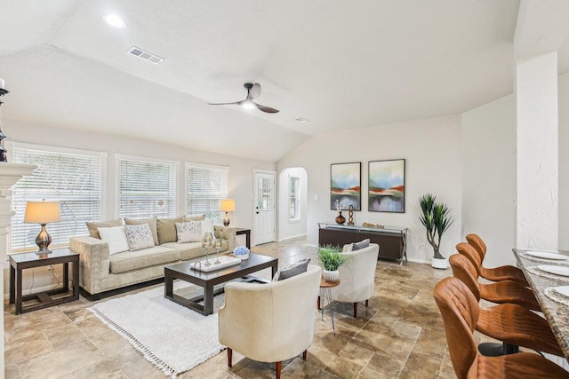 living room featuring lofted ceiling and ceiling fan