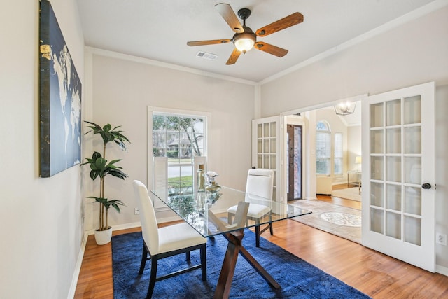 office area featuring visible vents, french doors, crown molding, and wood finished floors