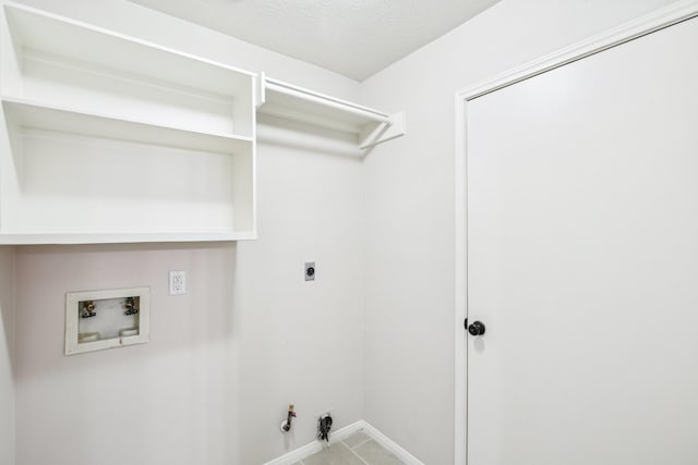 laundry room featuring gas dryer hookup, hookup for an electric dryer, tile patterned flooring, and hookup for a washing machine