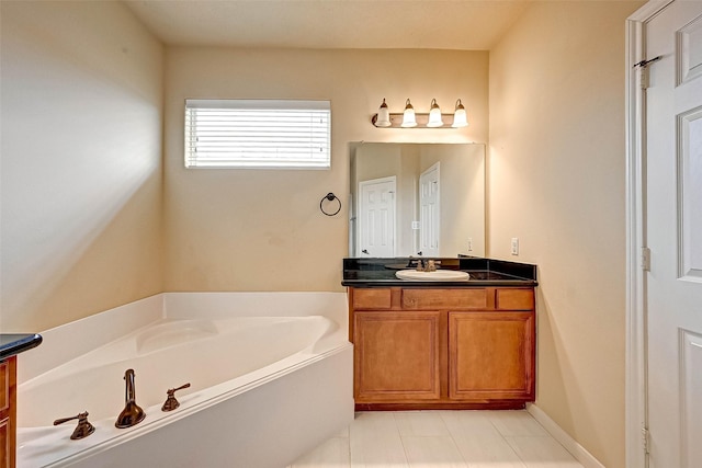 bathroom featuring vanity and a washtub