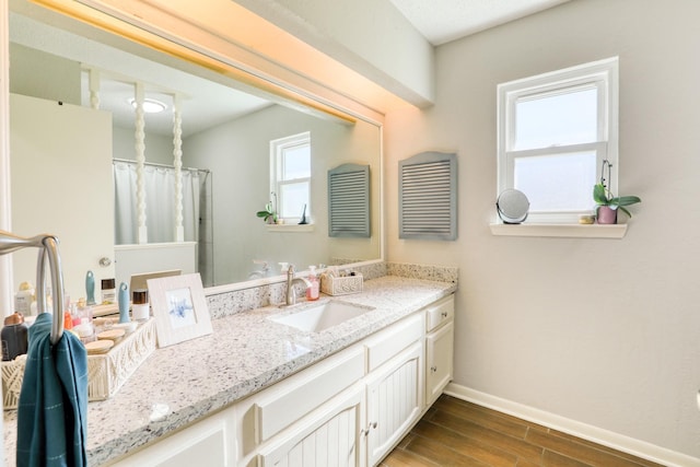 bathroom with vanity and a shower with shower curtain