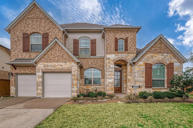 view of front of home featuring a garage and a front lawn