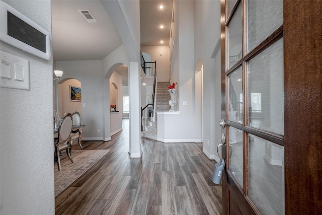 entrance foyer with dark hardwood / wood-style flooring