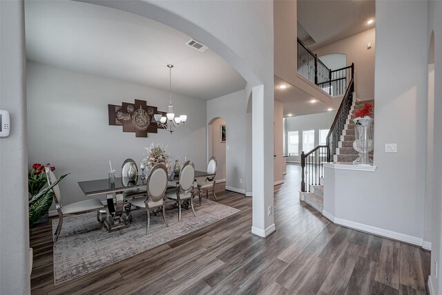 dining room featuring an inviting chandelier and hardwood / wood-style flooring