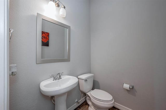 bathroom with toilet and sink