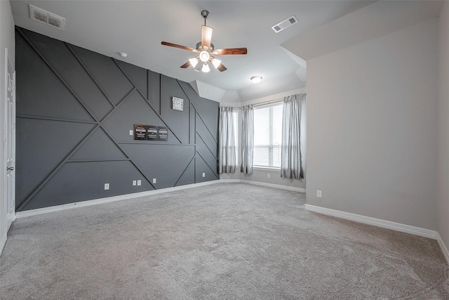 spare room with carpet floors and ceiling fan