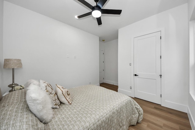 bedroom featuring wood-type flooring and ceiling fan