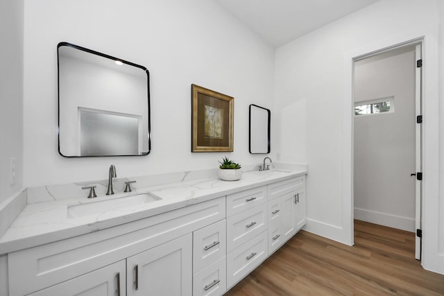 bathroom featuring vanity and hardwood / wood-style floors