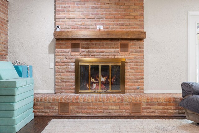 interior details with hardwood / wood-style flooring and a fireplace