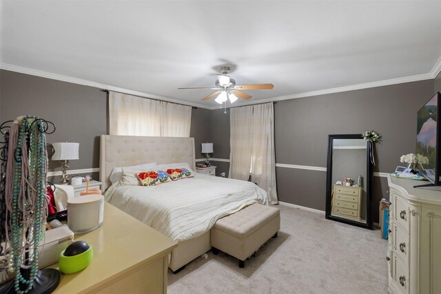 carpeted bedroom with crown molding and ceiling fan