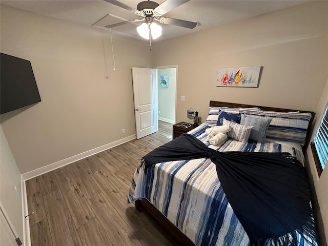 bedroom featuring ceiling fan and hardwood / wood-style floors