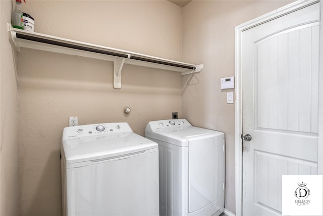 washroom with separate washer and dryer