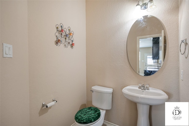 bathroom featuring toilet