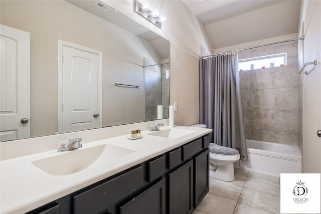 full bathroom with vanity, toilet, tile patterned flooring, and shower / bath combo with shower curtain