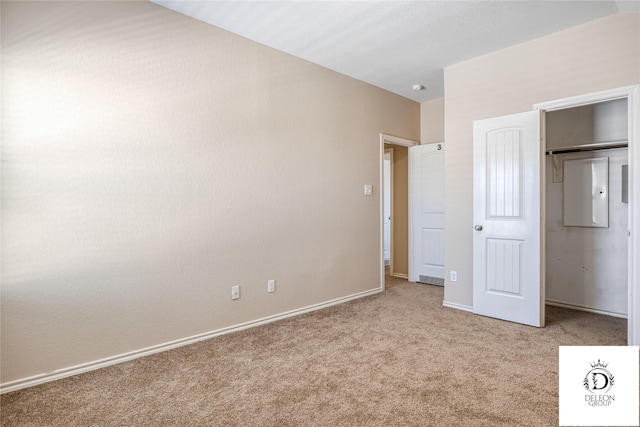 unfurnished bedroom featuring light carpet