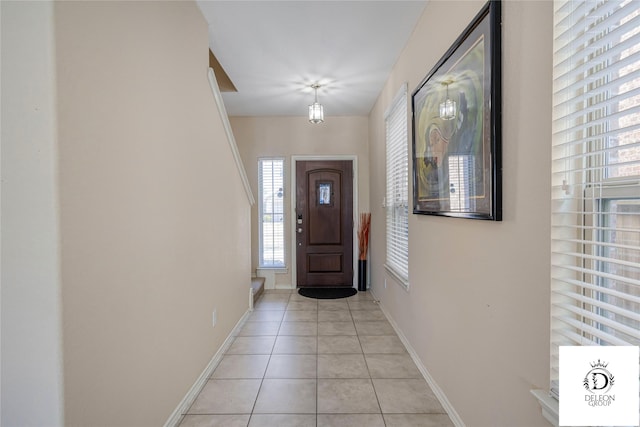 entrance foyer with light tile patterned floors