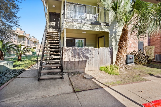 exterior space with central AC and a balcony