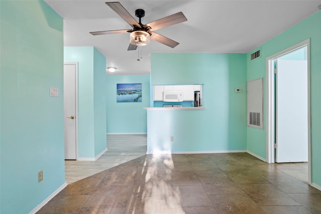 spare room with ceiling fan