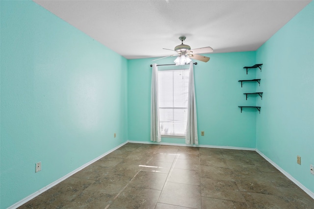 spare room with ceiling fan